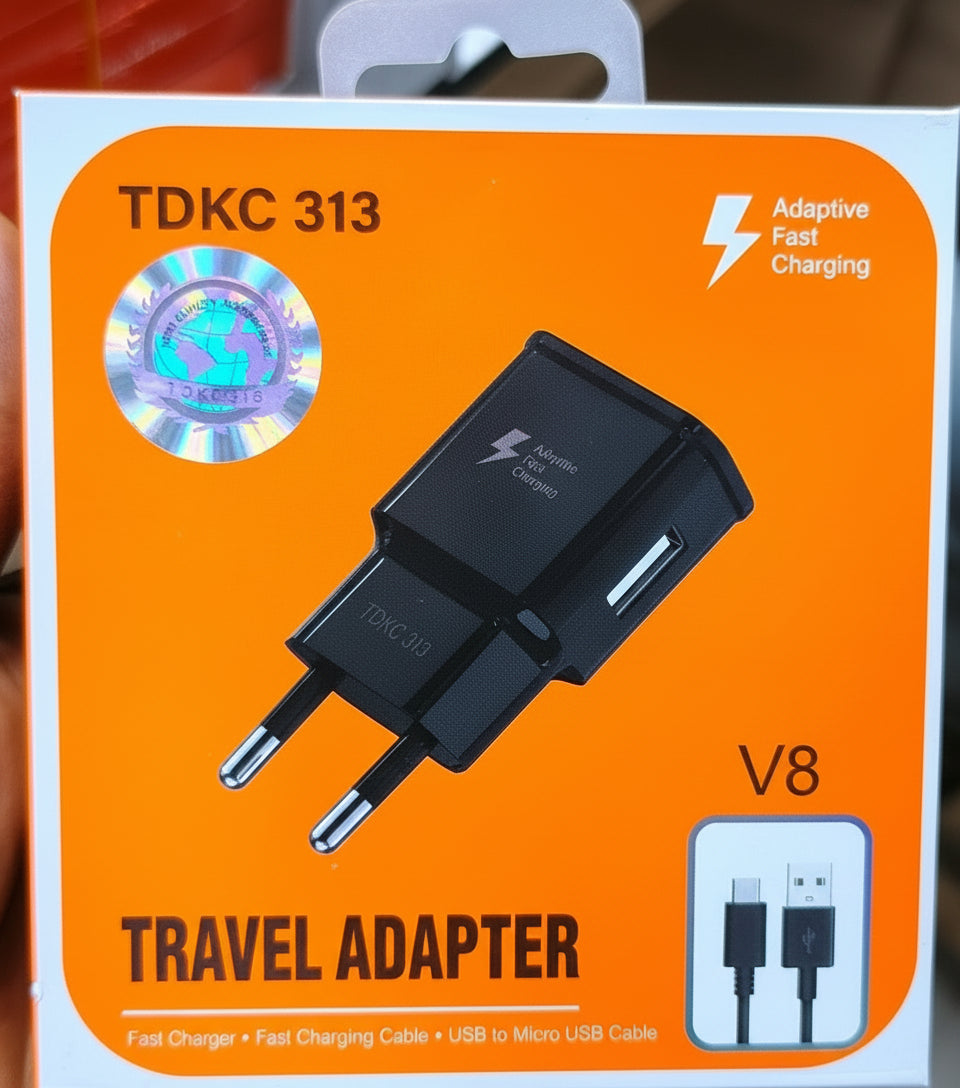 Travel adapter packaging with TDKC 313 label on an orange background